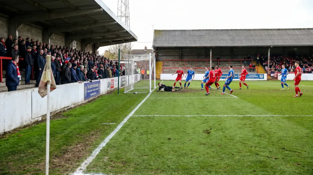 League Two football match with open attacking play and high goal expectancy