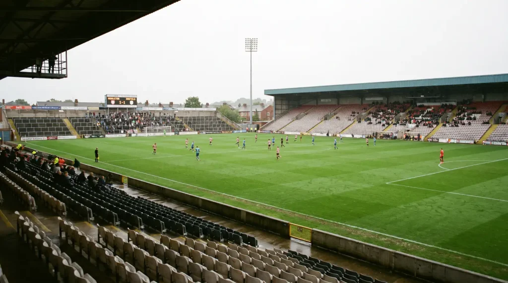 Empty seats at a mid-table football fixture highlighting reduced motivation late in season