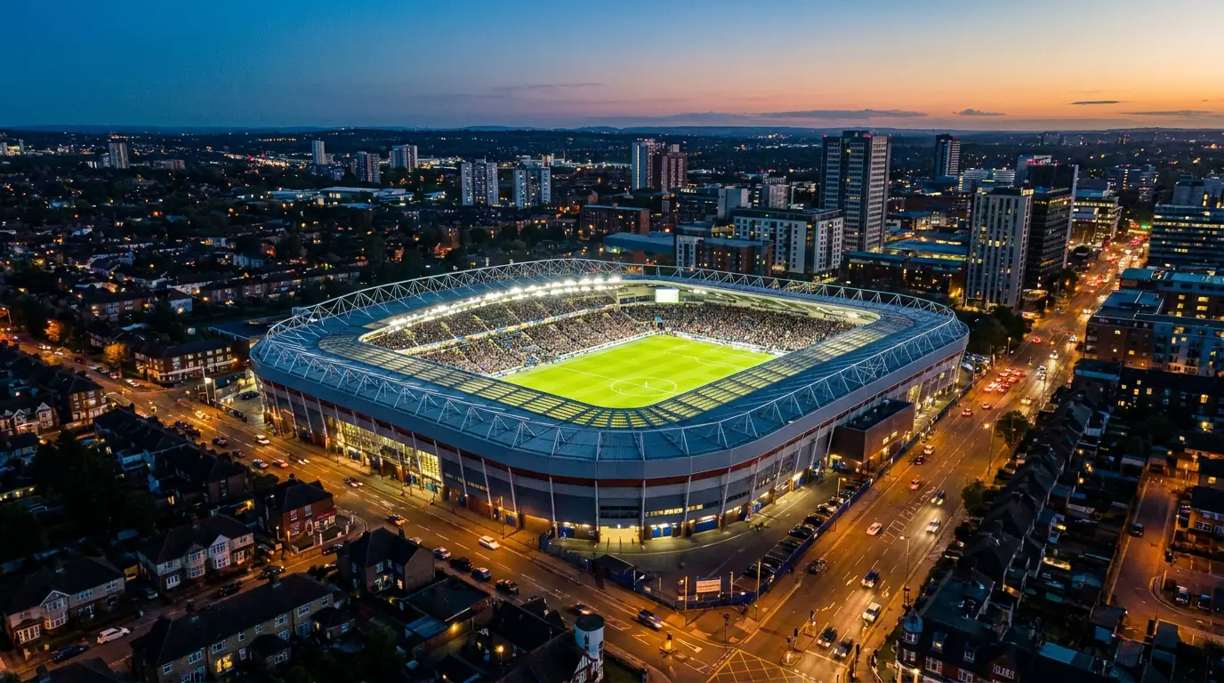 Aerial view of a Premier League stadium surrounded by city buildings on matchday